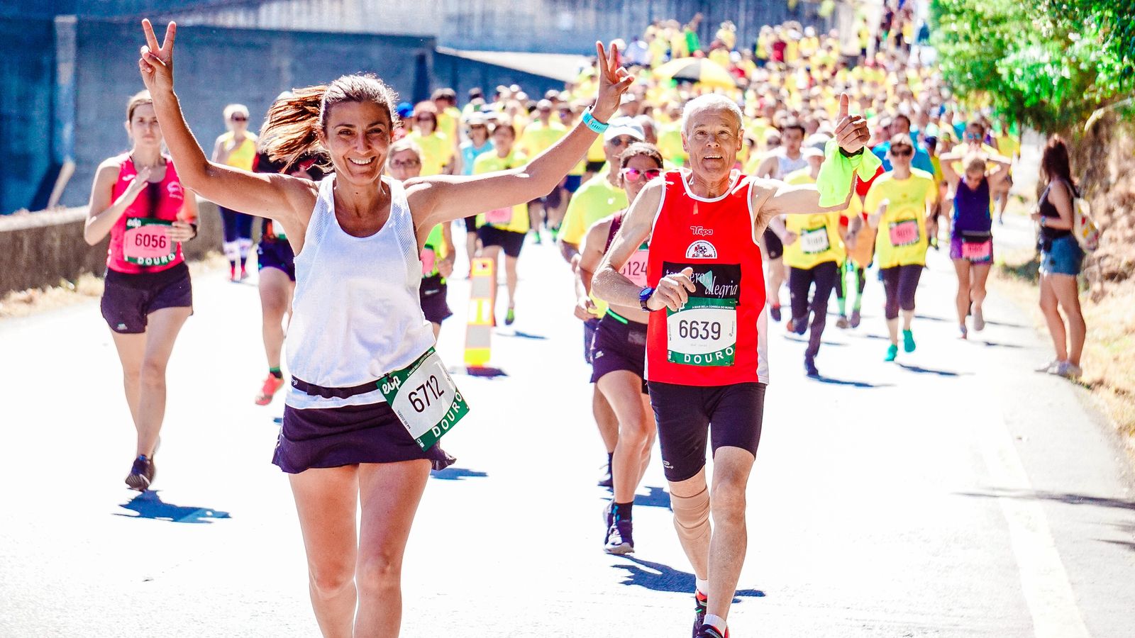 Road runners moving through a race course — Products for Improving Cardio: Shoes, Trackers, Machines, and Fuel